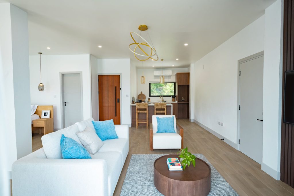 Harbour Villa 1 living room with a white sofa and blue cushions