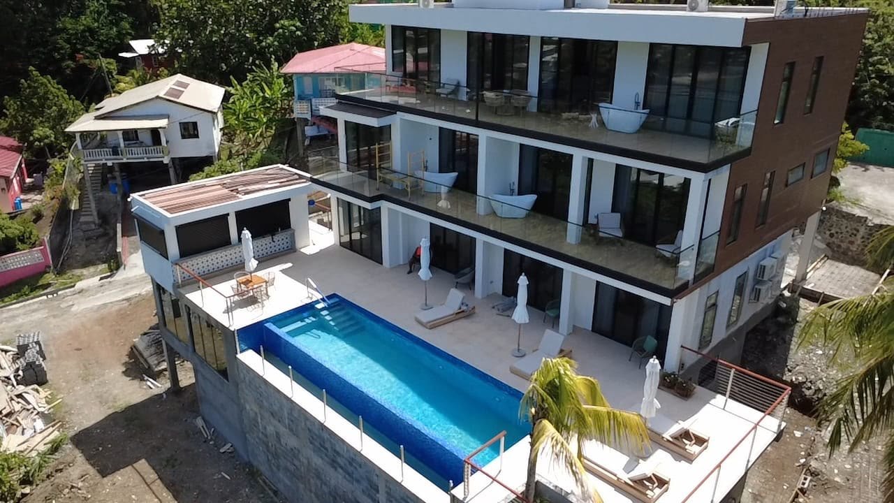 Aerial view of Palms La Batterie and its infinity pool deck