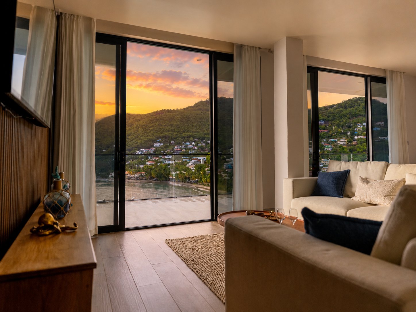 Penthouse living room looking out over Laborie Bay at sunset