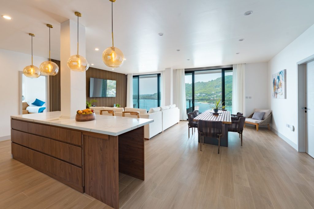 Open-plan Penthouse kitchen, dining and living room with sea views