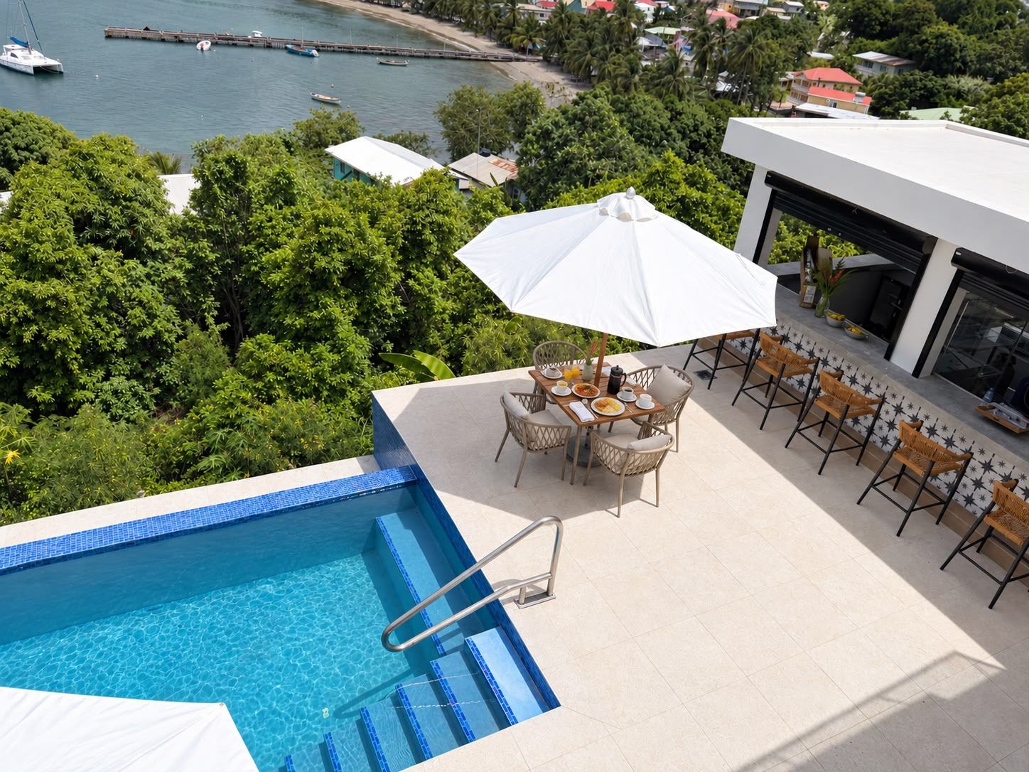 Breakfast table on the pool deck above Laborie Bay, seen from above